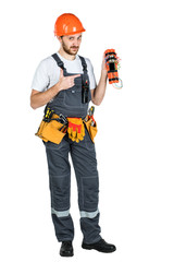 A man builder holds a bomb and explosives in his hands. Isolated over white background.
