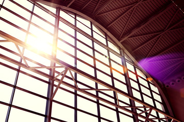 Interior of business center. Modern buildings. Window design. Light and shadow. Morning sun