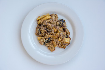 Homemade oatmeal cookies on plate on the white background. view from above.