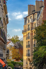 Fototapeta na wymiar View with old restaurant with windmill Moulin de la Galett, Paris