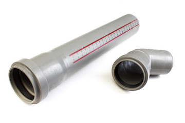 Assorted PVC sewage pipe fittings shot on white. Top view.