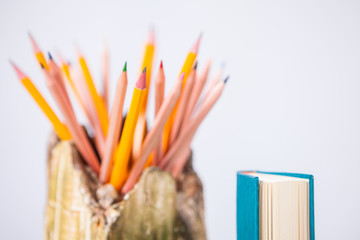 Pile of various books on wooden background