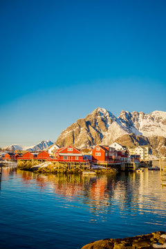 View of many wooden houses in the shore of Henningsvaer in Lofoten islands