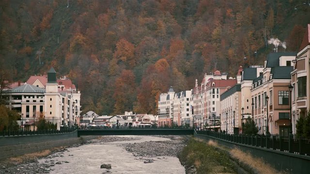 Mountain river slowing in Sochi on a cloudy autumn day. Concept of tourism and natural beauty. A cable road in the background. Locked down real time medium shot