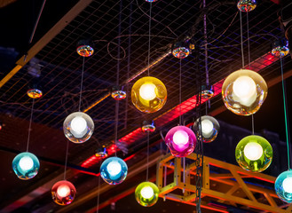 colorful bright lamps against a dark background