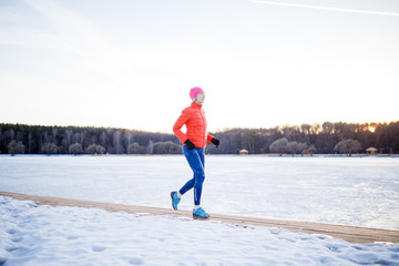Fototapeta na wymiar Image of sports girl on morning exercise in winter
