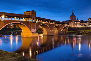 Obraz na płótnie Canvas Sunset view over the Covered Bridge in Pavia