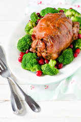 Baked roll from turkey thigh with broccoli and cranberries
