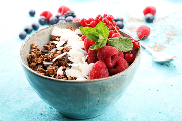 granola healthy breakfast with natural yogurt, muesli and berries