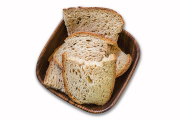 Sour yeast bread slices in the basket. Tradtional homemade bread on white background