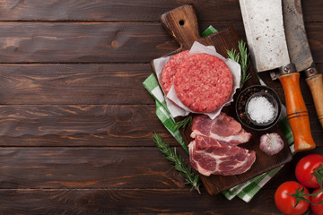 Raw minced meat and ingredients for burgers