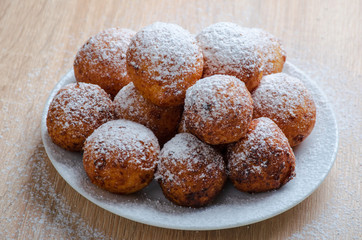 Curd cheese doughnuts on wooden background
