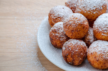 Fototapeta premium Curd cheese doughnuts on wooden background