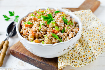 Buckwheat stewed with vegetables: zucchini, carrots, bell peppers, tomatoes and onions