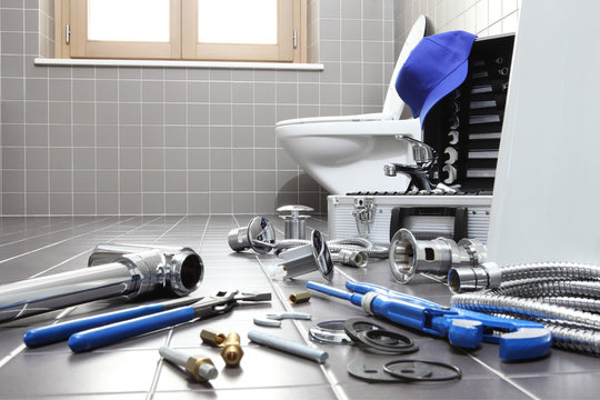 plumber tools and equipment in a bathroom, plumbing repair service, assemble and install concept