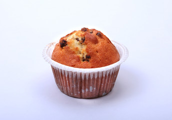 Fresh homemade muffins on white background. Top view.