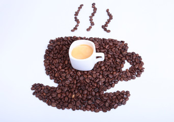 Fresh tasty espresso cup of hot coffee with coffee beans on white background.