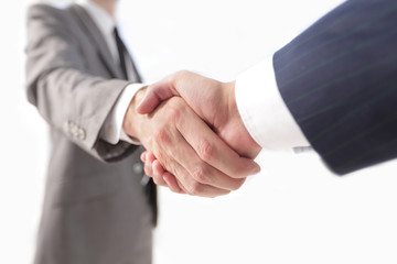 Diverse business male shaking hands.