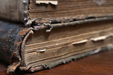 An old, dilapidated yellowed book. Sheets of an old book. Macro