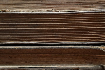 An old, dilapidated yellowed book. Sheets of an old book. Macro