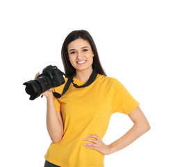 Young female photographer with camera on white background