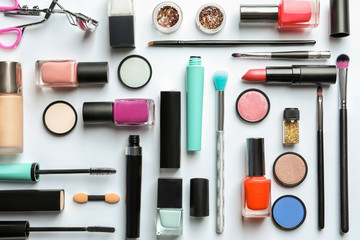 Flat lay composition with decorative cosmetics on white background