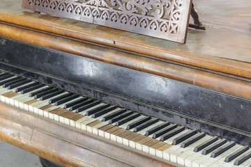 Fototapeta na wymiar Classic old grand piano, with shabby keys