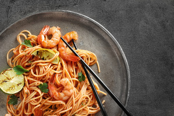 Delicious pasta with shrimps on plate