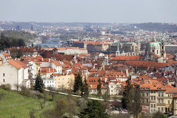 Naklejka na ściany i meble View on the sunny spring Prague with St. Nicholas' Cathedral, Czech Republic
