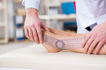 Doctor checking patients joint flexibility