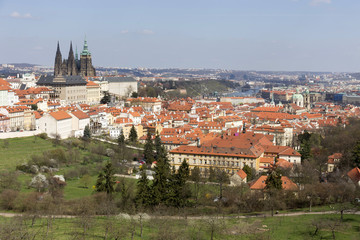 Spring Prague City with gothic Castle and the green Nature and flowering Trees, Czech Republic