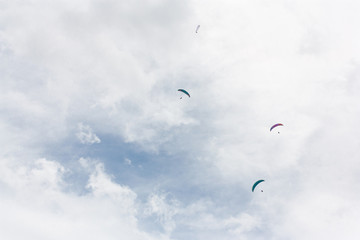 Skydivers in the clouds