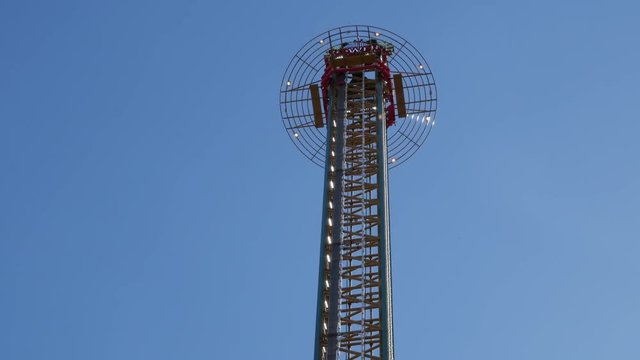 High tower drop in an amusement park. Adrenaline overload experience.
