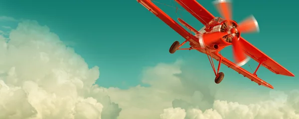 Foto op Plexiglas Oud vliegtuig Rode tweedekker vliegen in de bewolkte hemel. Retro stijl