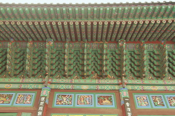 Colorful wall and under roof structure details in Jogyesa temple, the buddhism temple in Seoul, South Korea