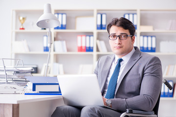 Disabled businessman working in the office