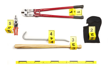 Bolt cutters, baseball bat, balaclava, pliers and other props of burglary documented as evidence of...