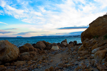 Beach. Sunset on a stone beach in Estepona.