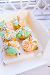 Appetizing cakes with cream in a beautiful package