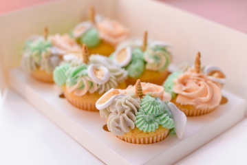 Appetizing cakes with cream in a beautiful package