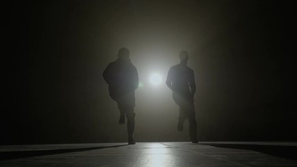Dancers male band rehearsing a synchronized choreography dance on the stage before the dancing competition