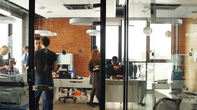 Portrait of happy young business team in modern office. Work in loft interior.