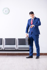 Man wairing to boarding in airport lounge room