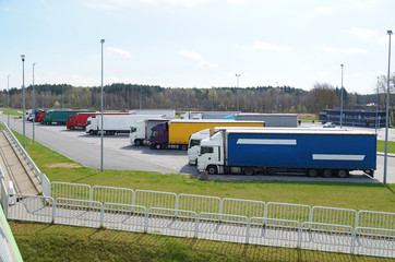 Weekend break in drivers' work. Rest area filled with lorries.