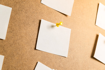 white stickers for notes on a cardboard background