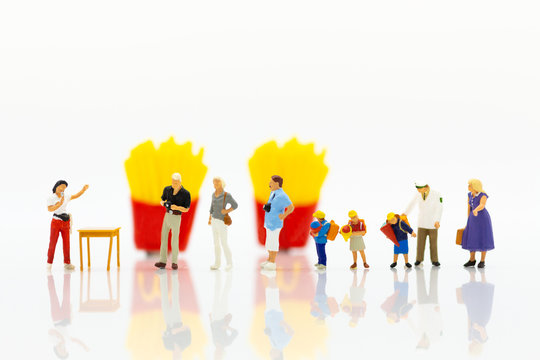 Miniature people : People standing in line to buy snack. Image use for Franchise business for trading.