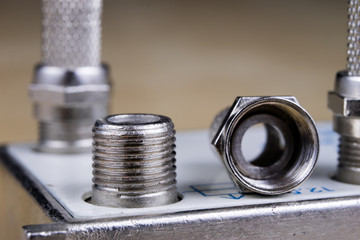 F-type connector in the enlargement. Accessories used for the installation of cable television.