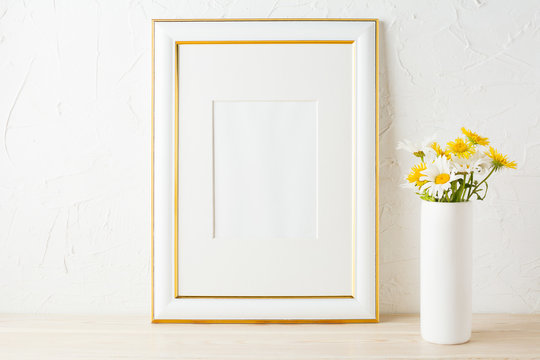 Gold decorated frame mockup with yellow and white daisy
