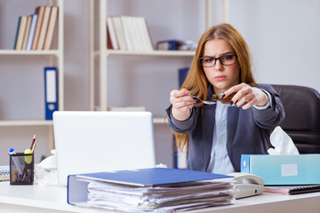 Businesswoman employee sick in the office
