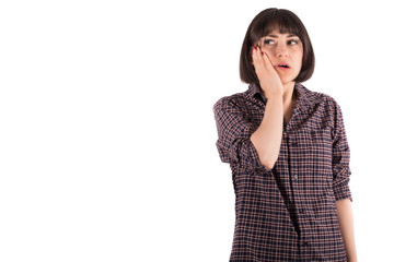 Young Woman Holding Her Cheek in Shock